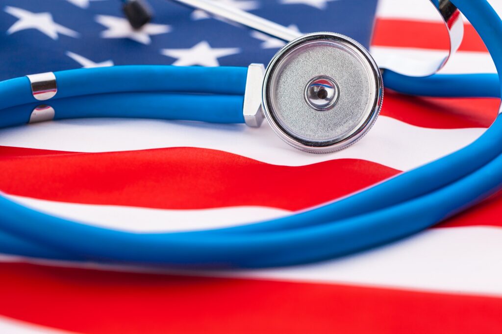 Stethoscope on American national flag, close up